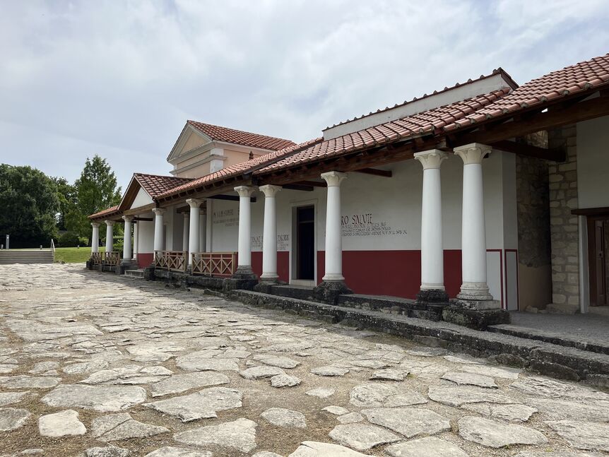 outside view of a building in Roman style with white columns